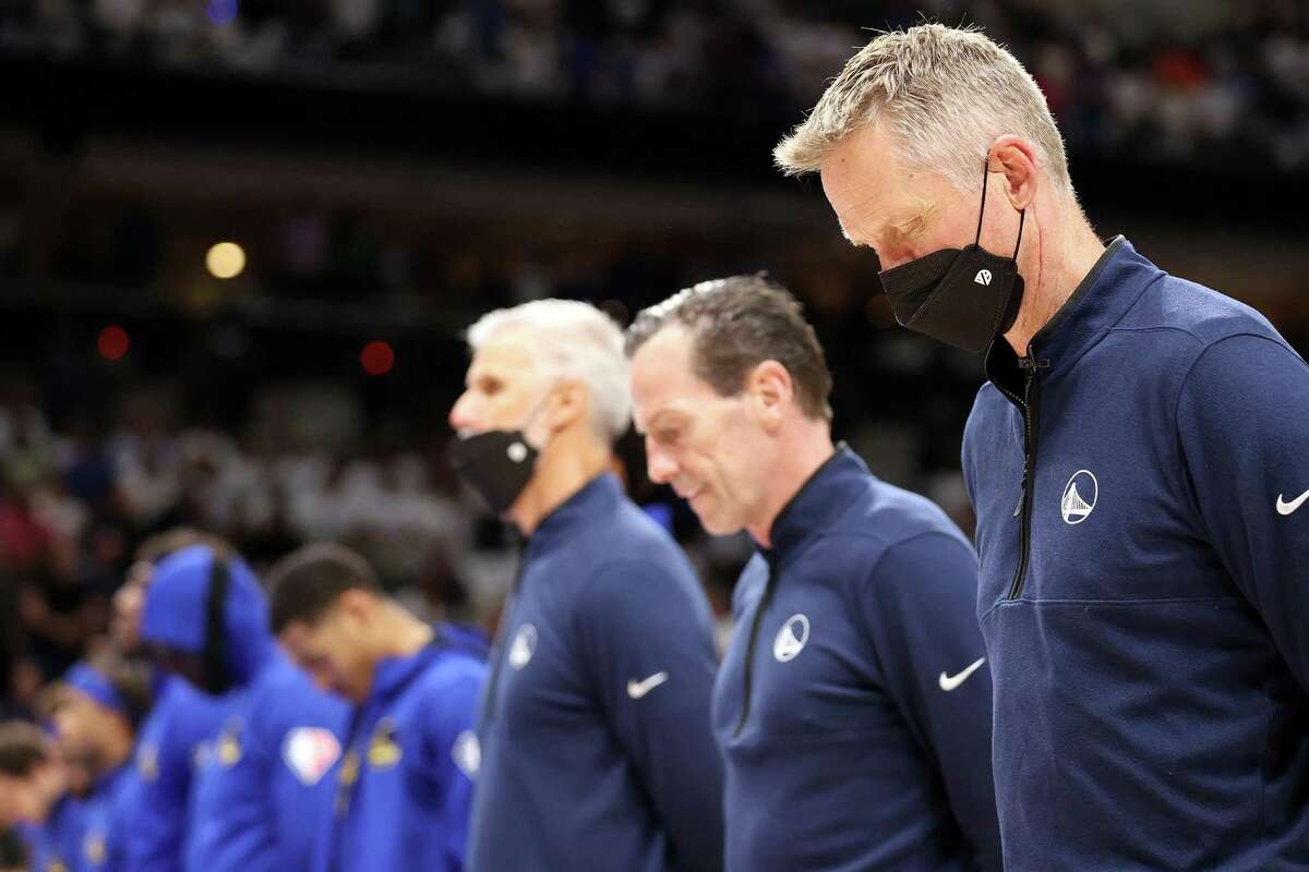 During a moment of silence for the victims of the Texas school shooting earlier in the day, Golden State Warriors’ head coach Steve Kerr bows his head before the Warriors play Dallas Mavericks of Game 4 of NBA Western Conference Finals at American Airlines Center in Dallas, Texas, on Tuesday, May 24, 2022.