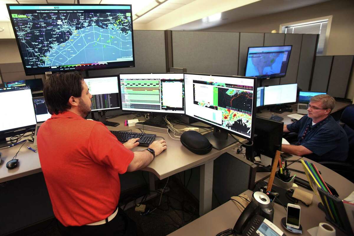 Meteorologists Sean Luchs, left, and Brian Kyle monitor the area weather at the National Weather Service offices Monday, May 23, 2022 in Dickinson.