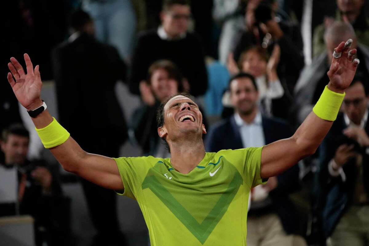 Spain's Rafael Nadal celebrates winning his quarterfinal match against Serbia's Novak Djokovic in four sets, 6-2, 4-6, 6-2, 7-6 (7-4), at the French Open tennis tournament in Roland Garros stadium in Paris, France, Wednesday, June 1, 2022.