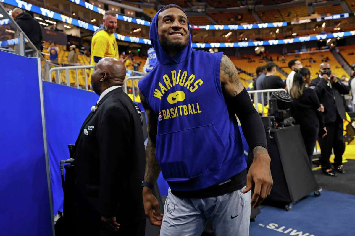 Golden State Warriors guard Gary Payton II (0) walks back to the locker room before Game 2 of the Western Conference finals against the Dallas Mavericks at Chase Center, Friday, May 20, 2022, in San Francisco, Calif. Payton II is out due to injury.