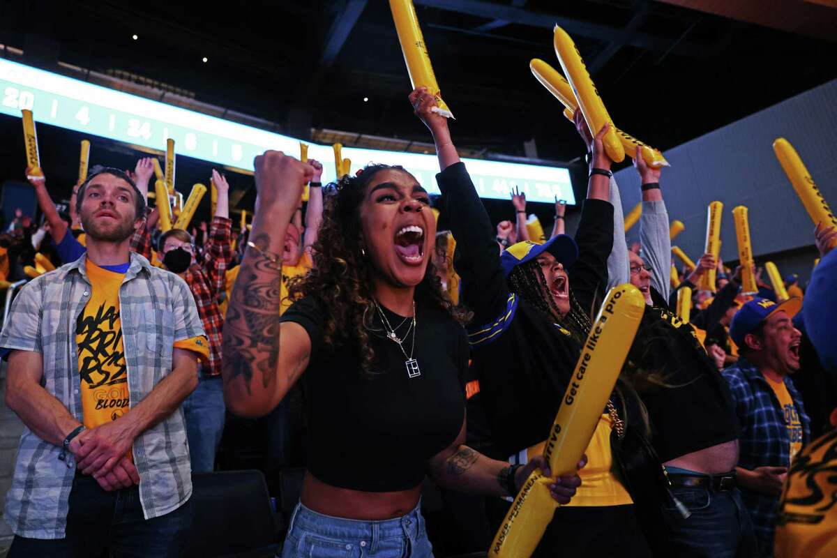 Fan Camila Dayson (center) cheers during the fourth quarter of the Golden State Warriors Game 2 of the Western Conference Finals against the Dallas Mavericks at Chase Center on Friday, May 20, 2022 in San Francisco, California.