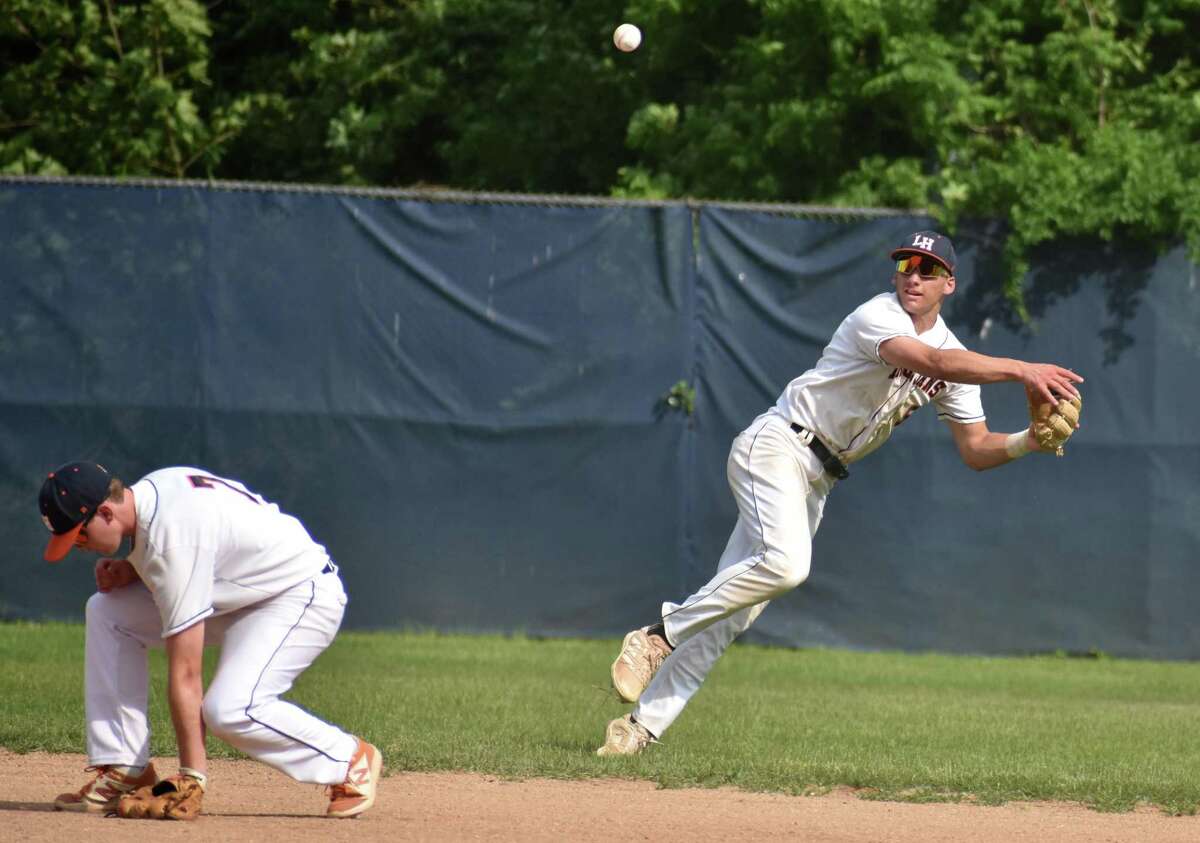 Lyman Hall's Justin Hackett throws to first during the Class L baseball tournament first round between Lyman Hall and North Haven at Pat Wall Field, Wallingford on Tuesday, May 31, 2022.