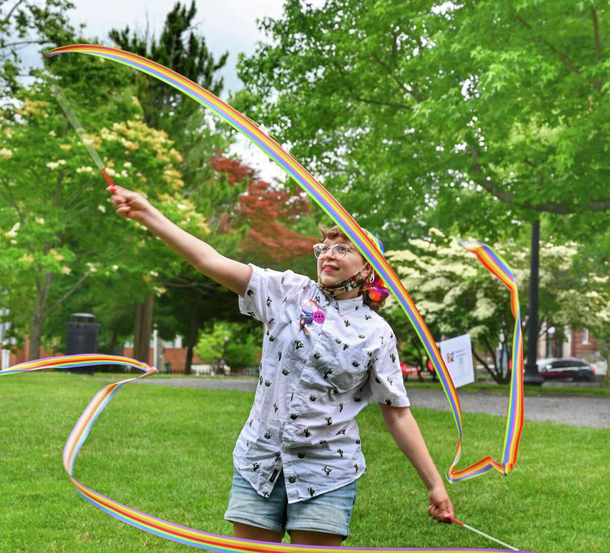 An attendee of Ridgefield's Pride in the Park event at the Ballard Park in Ridgefield, has fun with ribbons at the event.