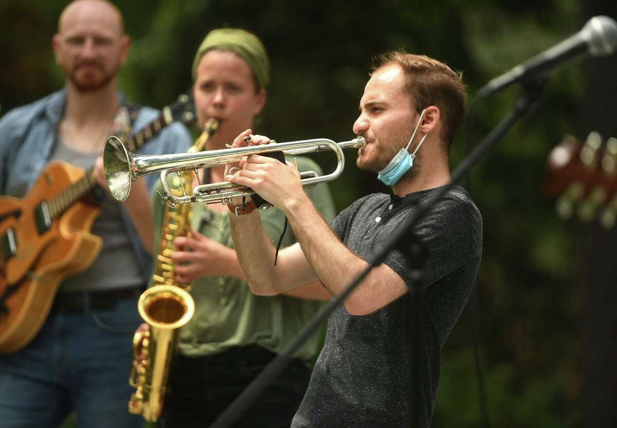 From left; Chris Arnone, of Newtown, Malin Carta, of Glastonbury, and Austin Iesu, of Newtown, perform with the Bach To Rock Faculty Band during Make Music Day at Ballard Park in Ridgefield, Conn. on Monday, June 21, 2021. This year’s Make Music Day is one event to look forward to in June.