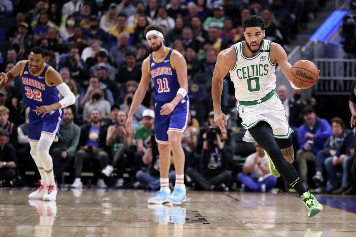 Boston Celtics' Jayson Tatum heads up court after a Golden State Warriors' turnover in 1st quarter during NBA game at Chase Center in San Francisco, Calif., on Wednesday, March 16, 2022.