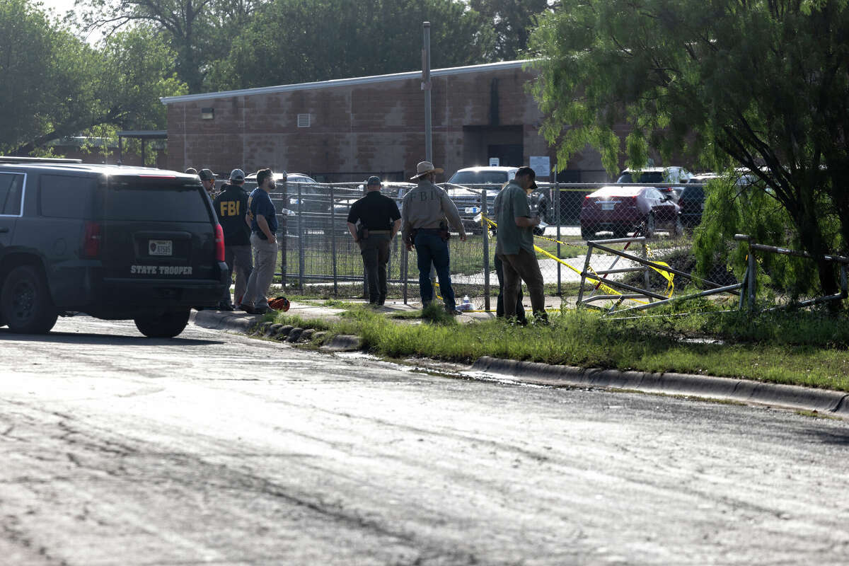 UVALDE, TX - MAY 25: Law enforcement survey the area where the gunman crashed his truck prior to entering Robb Elementary School and opening fire during a mass shooting yesterday where 21 people were killed, including 19 children, on May 25, 2022 in Uvalde, Texas. The shooter, identified as 18-year-old Salvador Ramos, was reportedly killed by law enforcement. (Photo by Jordan Vonderhaar/Getty Images)
