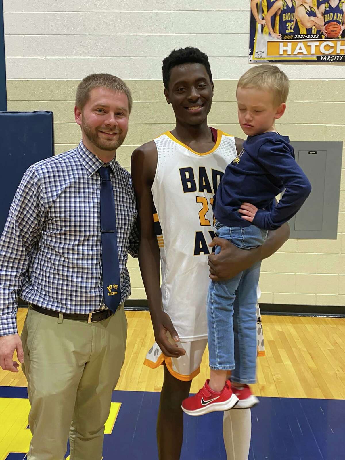 The Hatchets have hired Eric Glaza as their next basketball coach. Here, he is pictured with D'Carlos Sageman and "Coach Chase".