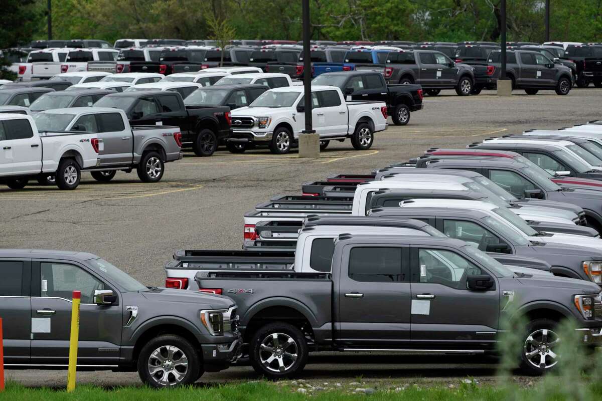 Ford pickup trucks built lacking computer chips are shown in parking lot storage in Dearborn, Mich., Tuesday, May 4, 2021. As the global shortage of computer chips for vehicles continues, The Woodlands Township is working to ensure it has the vehicles it needs in 2023.
