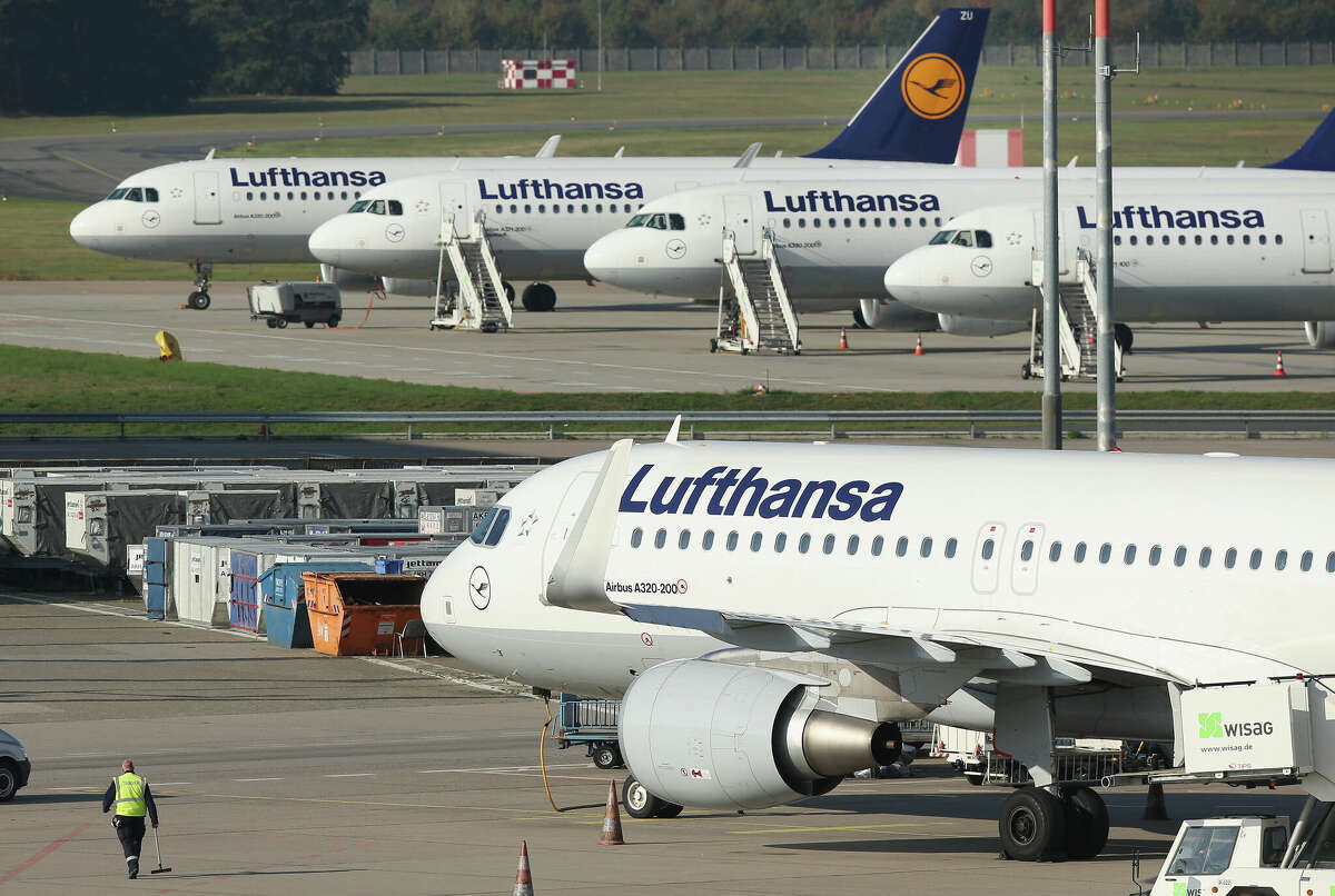 BERLIN, GERMANY - OCTOBER 21: Passenger planes of German ariline Lufthansa stand parked on the tarmac at Tegel Airport during a two-day strike by Lufthansa pilots on October 21, 2014, in Berlin, Germany.