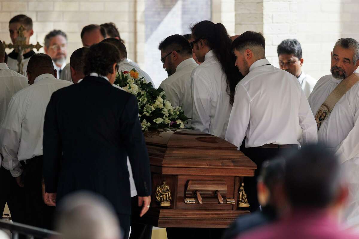 One of two caskets is carried into Sacred Heart Catholic Church in Uvalde on Wednesday morning at the start of a joint funeral for Irma Linda Garcia, 48, and her husband, Joe Garcia. Irma, a fourth grade teacher at Robb Elementary School, was killed in her classroom during the May 24 mass shooting there. Her husband of 24 years died a couple days later of a heart attack. The couple is survived by four children: Cristian, Jose, Lyliana and Alysandra Garcia.