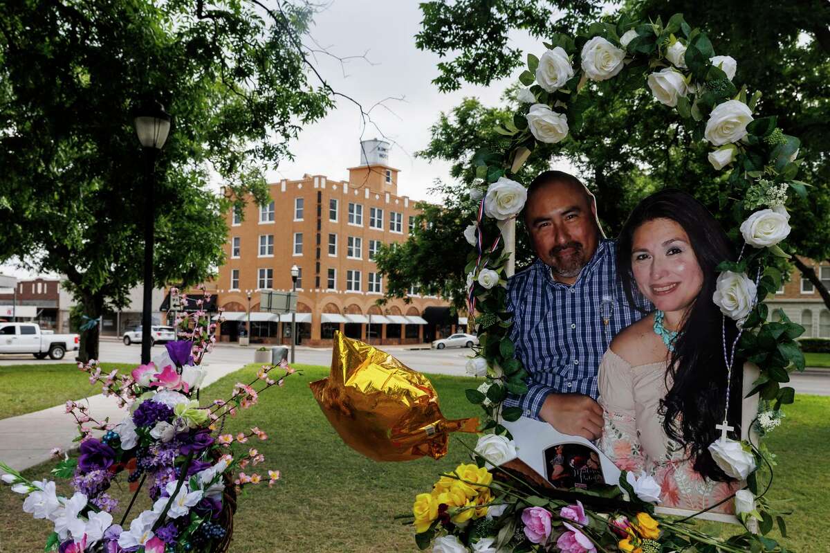 A picture of Joe and Irma Garcia is displayed at a public memorial at the city of Uvalde Town Square on Wednesday. Irma, a, fourth grade teacher at Robb Elementary School, was killed in her classroom during the May 24 mass shooting there. Her husband of 24 years died a couple days later of a heart attack. The couple is survived by four children: Cristian, Jose, Lyliana and Alysandra Garcia.