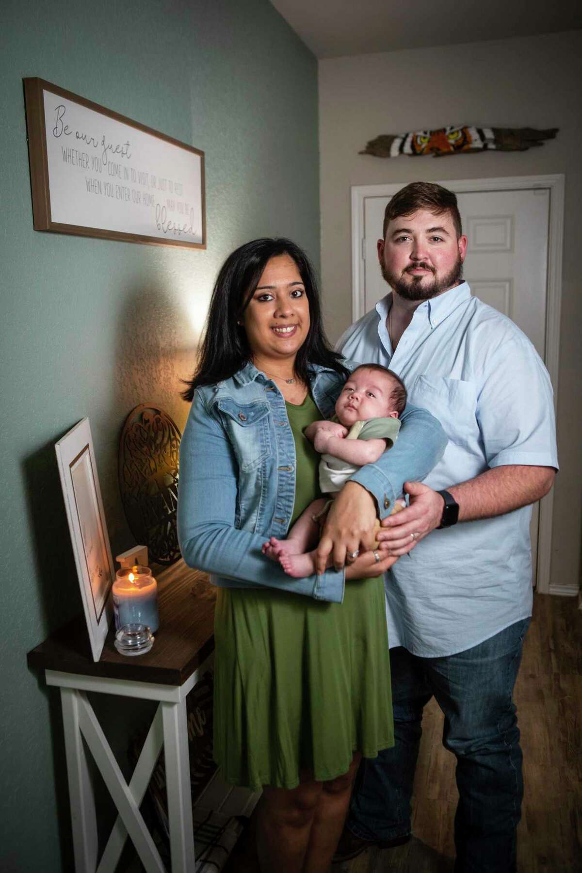 Juno and James Evans hold 3-month-old son Jaxson. Juno was pregnant when she learned that she needed surgery to fix a congenital heart defect.