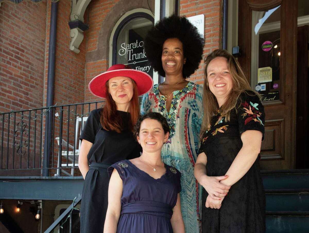 Honesta co-owners, clockwise from bottom, Lauren Neulander, Kathleen Willcox, Camille Daniels and Erin Maciel stand outside Palette on Monday, May 30, 2022 in Saratoga Springs, N.Y. Honesta locally roasts and sells coffee beans from single-origin female bean farmers in Brazil.