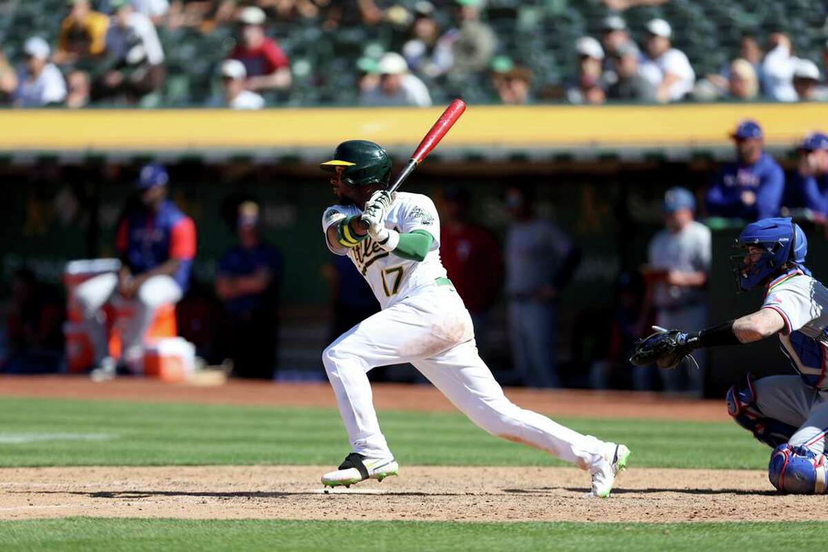 Oakland Athletics' Elvis Andrus (17) bats against the Texas Rangers during a baseball game in Oakland, Calif., Sunday, May 29, 2022. (AP Photo/Jed Jacobsohn)