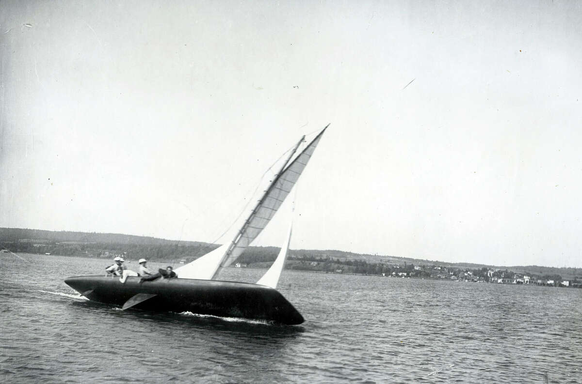 A yacht races across Portage Lake in Onekama circa early 1940s.