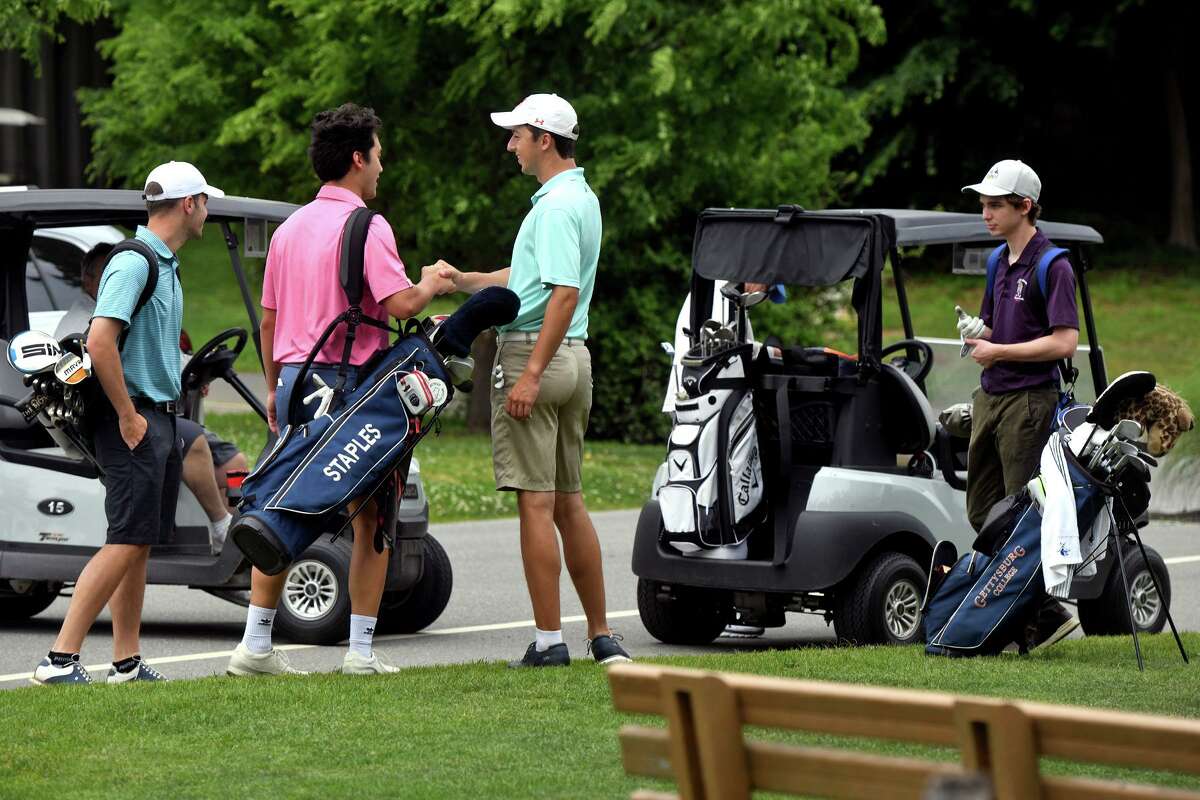 Golfers prepare to tee off at Longshore Club Park in Westport on June 1.