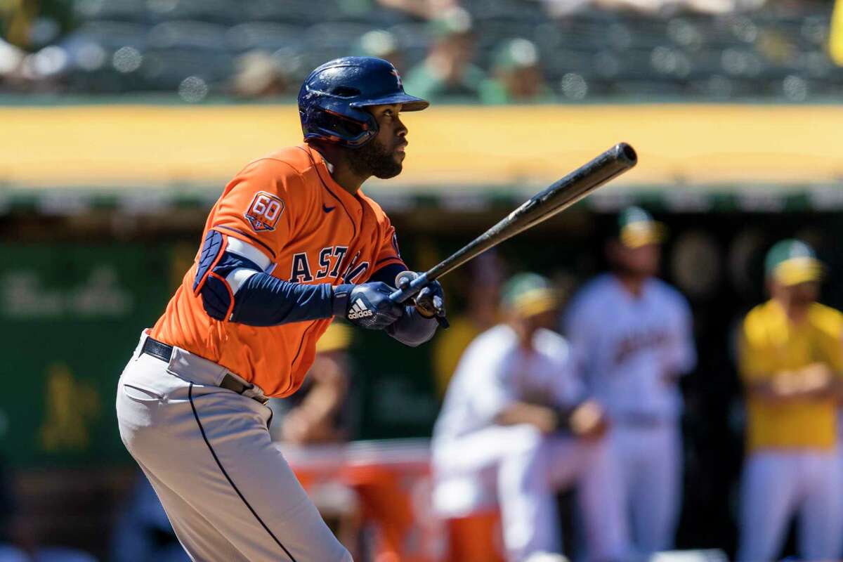 Yordan Alvarez watches his three-run double that gave the Astros the go-ahead runs during their ninth-inning rally Wednesday in Oakland.