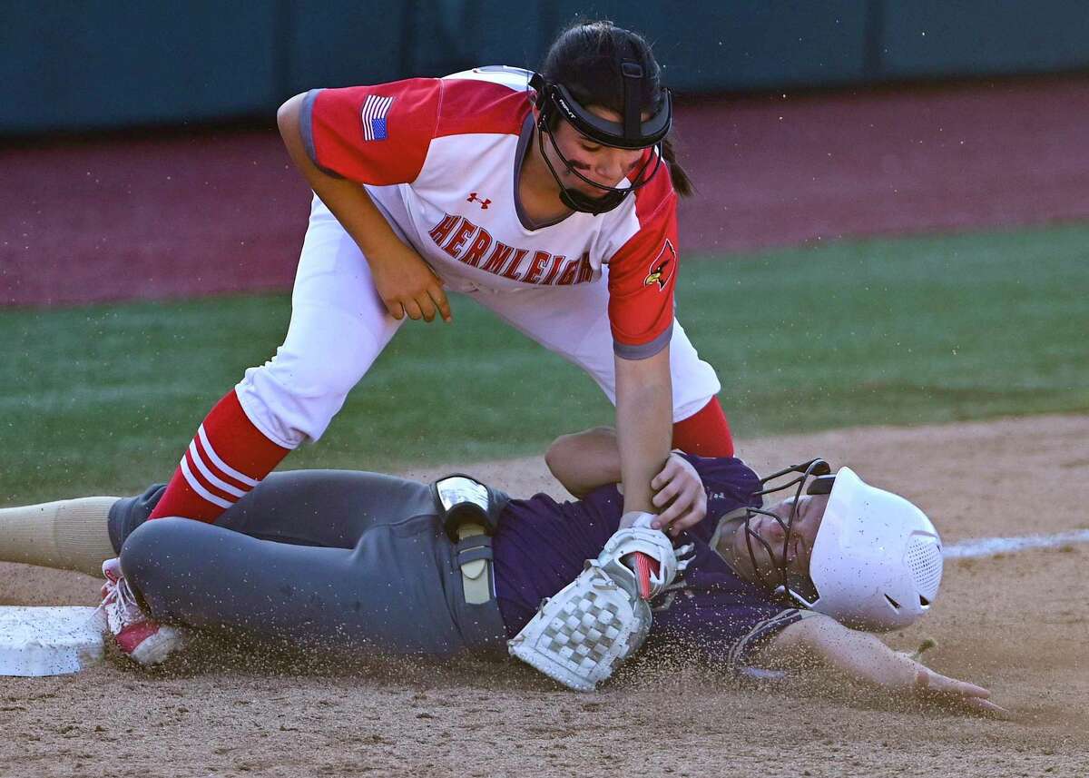 Mia Pence of Hermleigh tags out Kayla Looper of D’Hanis at third base during the Class 1A state final at Red and Charline McCombs Field in Austin on Wednesday, June 1, 2022.