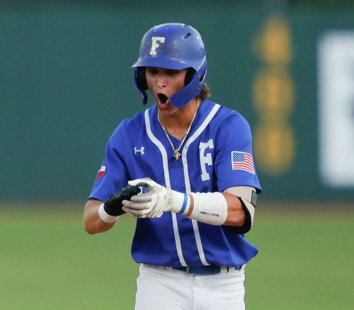 Kyle Lockhart #13 of Friendswood reacts after hitting an RBI single in the fourth inning of Game 1 during the Region III-5A high school baseball championship series at Rice University , Wednesday, June 1, 2022, in Houston. Friendswood scored four runs in the inning to take a 4-1 lead.
