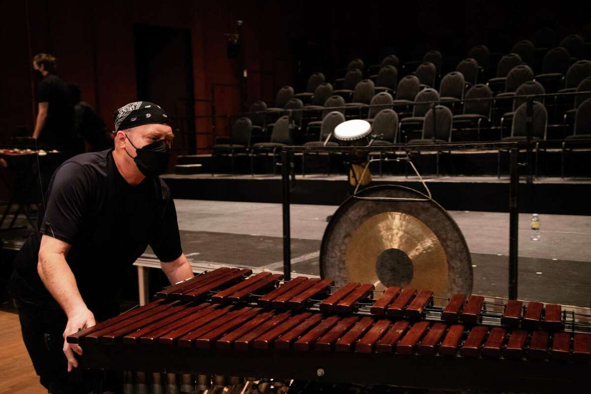 International Alliance of Theatrical Stage Employees workers remove Houston Symphony instruments and gear, Tuesday, May 31, 2022, at the Jesse H. Jones Hall for the Performing Arts in Houston, to get the space ready to start renovations.