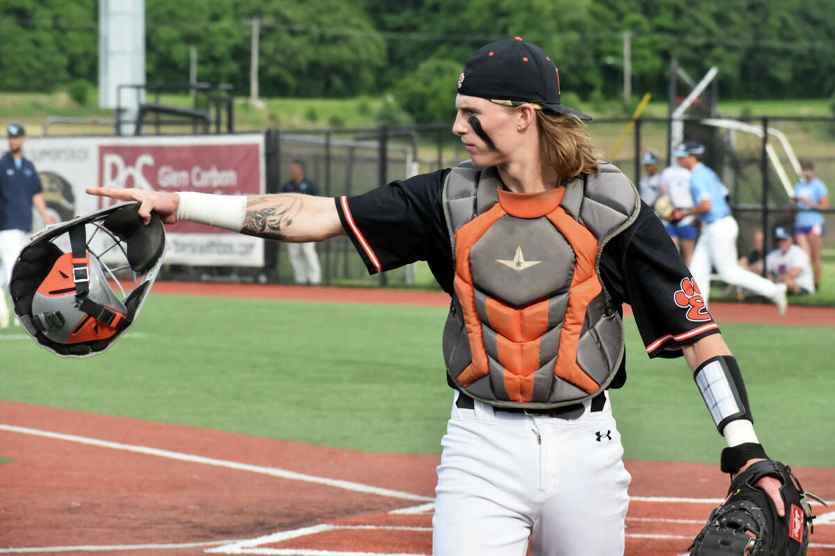 Edwardsville's Grant Huebner points to his starting pitcher Spencer Stearns after the first inning against Belleville East in the Class 4A Illinois Wesleyan Sectional semifinals on Wednesday at Roy E. Lee Field in Edwardsville.