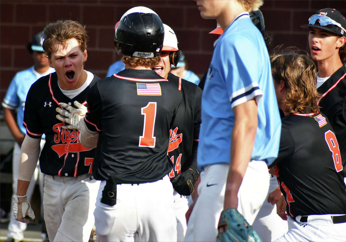 Edwardsville's Cade Hardy, left, celebrates after his inside-the-park home run against Belleville East in the Class 4A Illinois Wesleyan Sectional semifinals on Wednesday at Roy E. Lee Field in Edwardsville.
