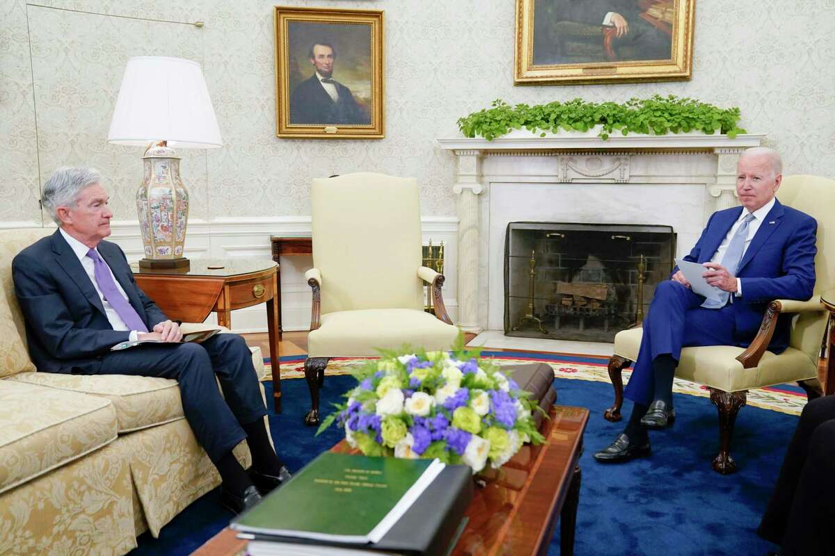 President Joe Biden meets with Federal Reserve Chairman Jerome Powell, left, and Treasury Secretary Janet Yellen in the Oval Office of the White House, Tuesday, May 31, 2022, in Washington.