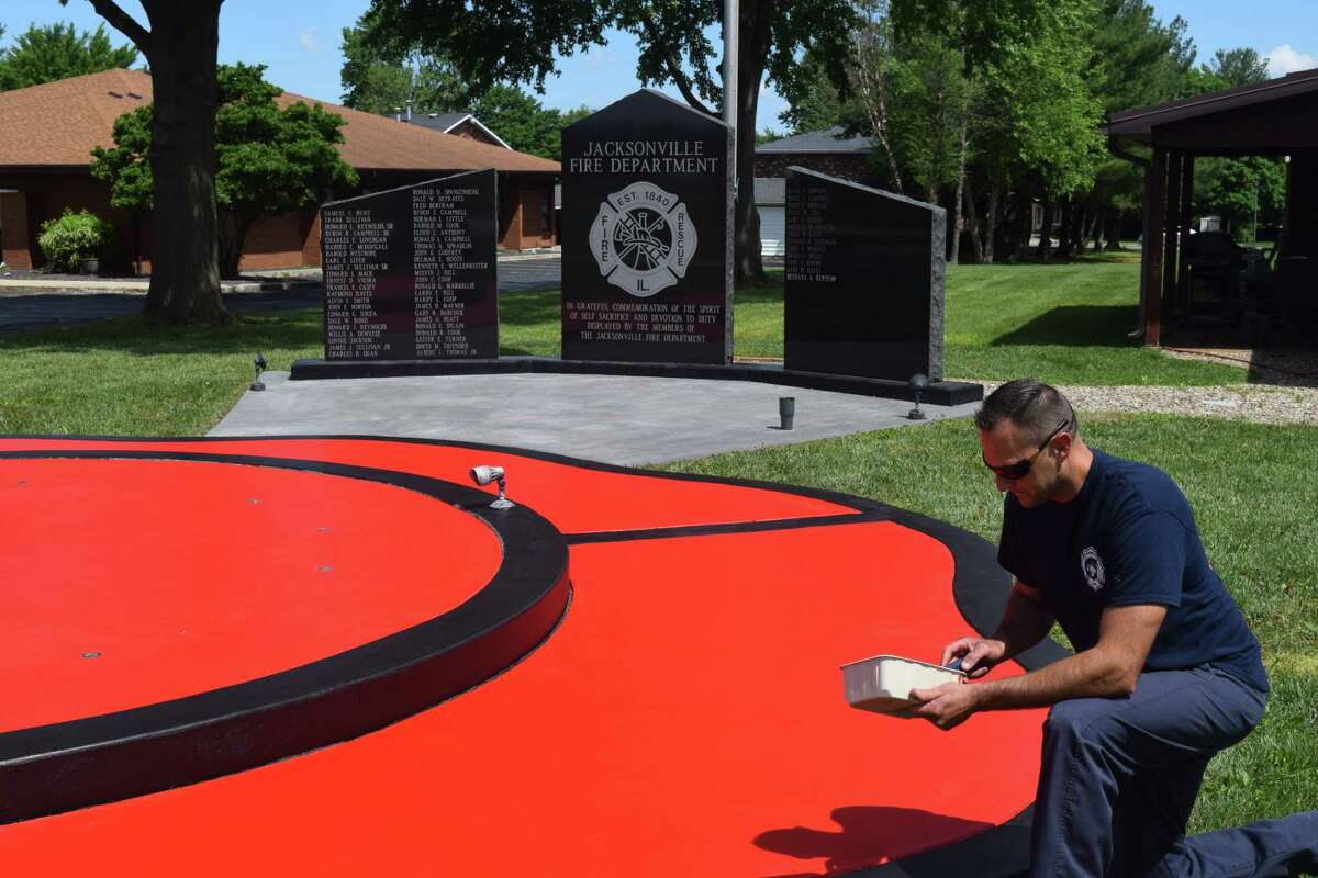 Driver/engineer Josh Sorrill was one of several firefighters taking advantage of beautiful weather to put a fresh coat of paint on a fountain at the Jacksonville Fire Department substation on West Lafayette Avenue.