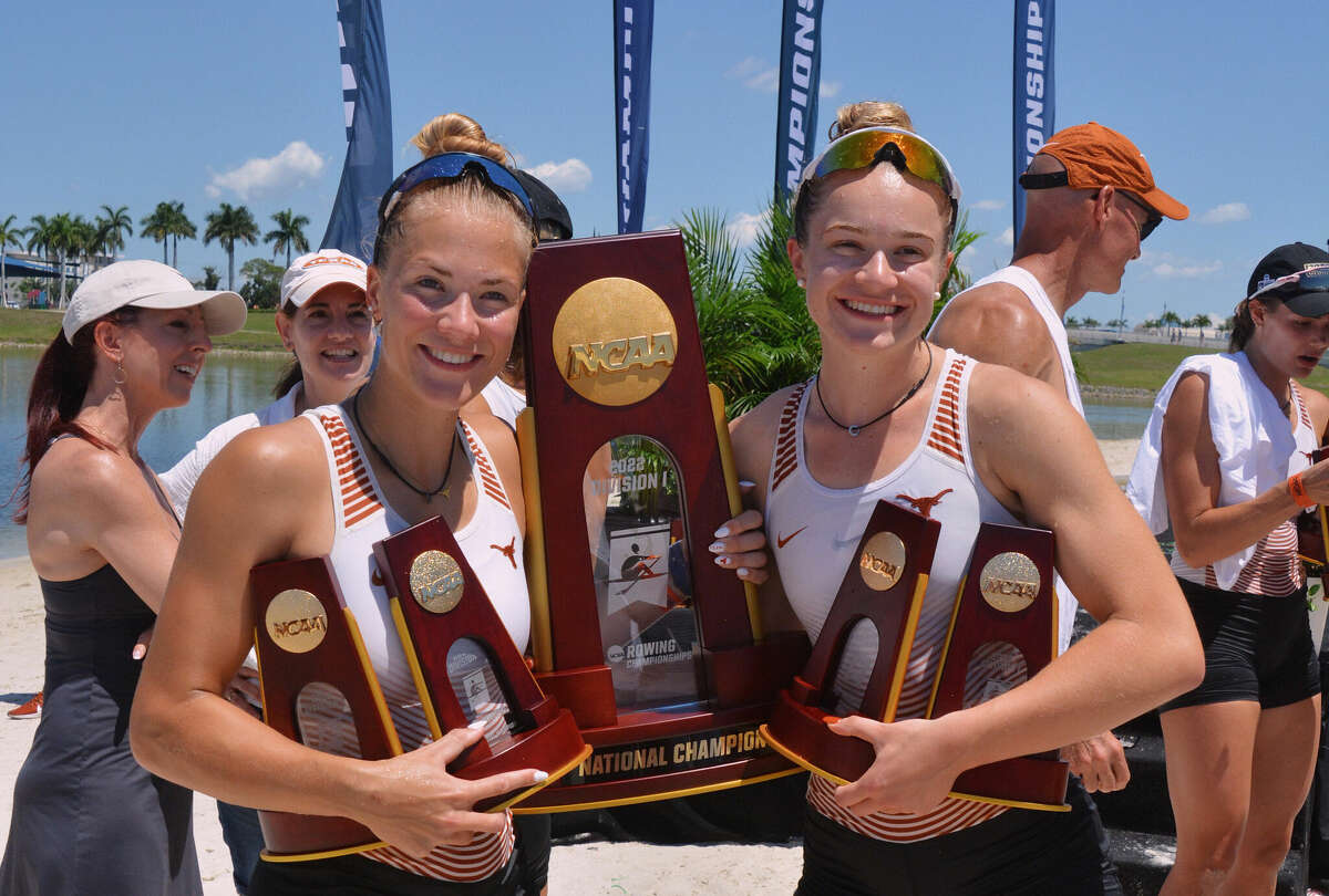 Dow High alum Anna Jensen (right) poses with a teammate -- and plenty of hardware -- after helping the University of Texas's women's rowing team win a second consecutive NCAA championship in Florida recently.