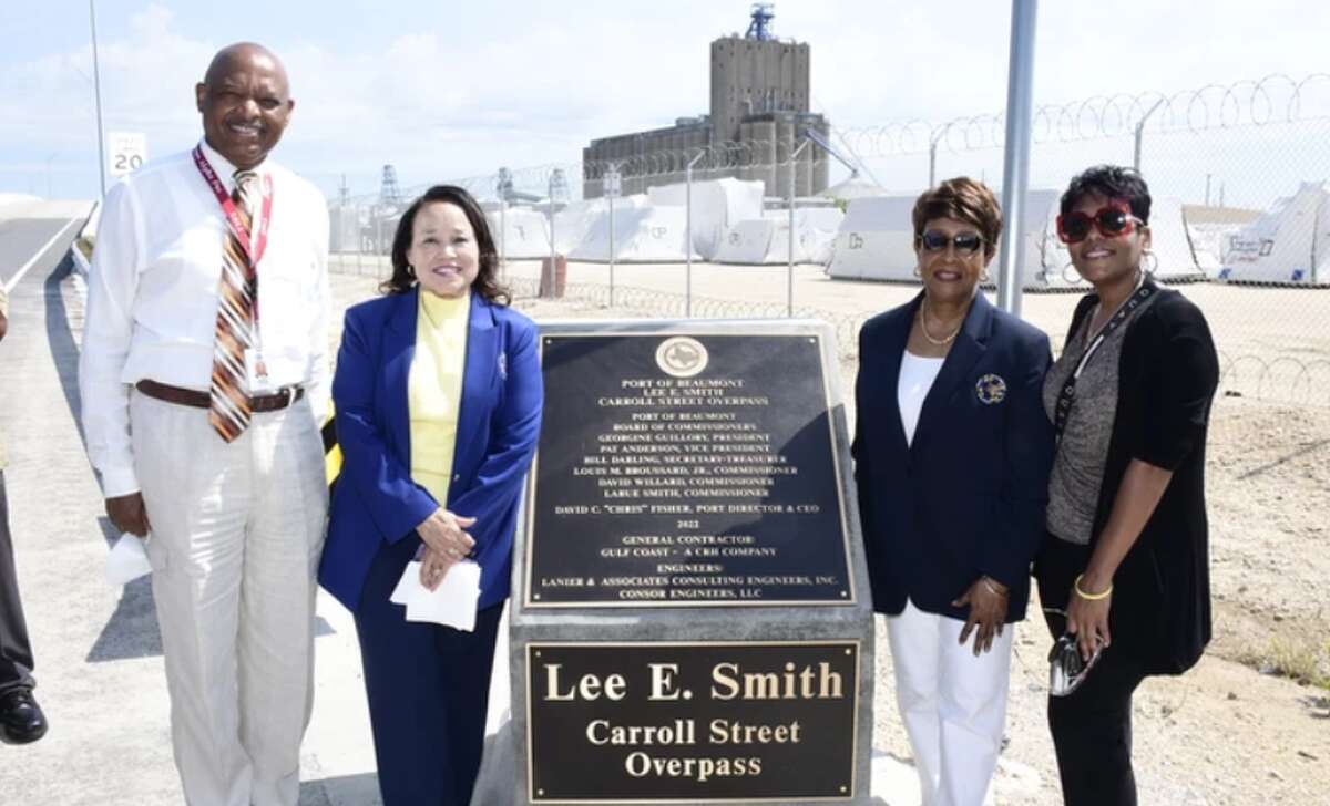 Ward III Port Commissioner LaRue Smith (second from right) and Board President Georgine Guillory (second from left) stand next to the dedication of the Carroll Street overpass to late Commissioner Lee E. Smith, May 26, 2022.LaRue Smith, wife of Lee, was tapped to take his place on the board after he died in 2021. P