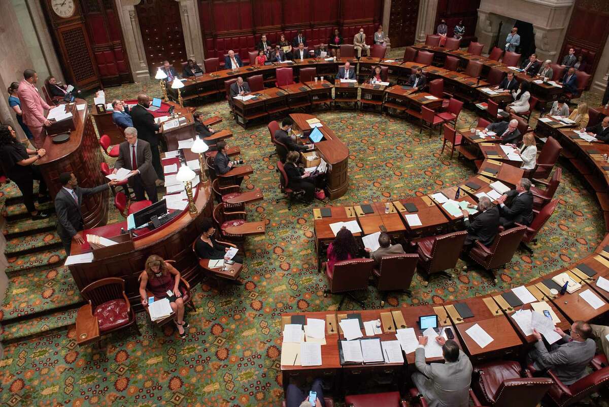 Lawmakers pass bills in the Senate Chamber at the New York State Capitol on the last day of session on Thursday, June 2, 2022 in Albany, N.Y.