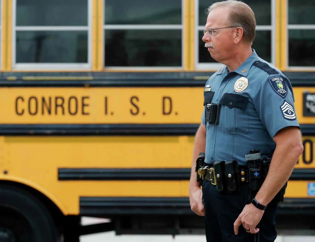 Conroe ISD police Sgt. Mike Mann monitors students’ arrival at Birnham Woods Elementary School on May 25, 2022. The Montgomery County Emergency Communication District it is partnering with school districts to implement panic button technology to help keep students and faculty safe during emergencies.