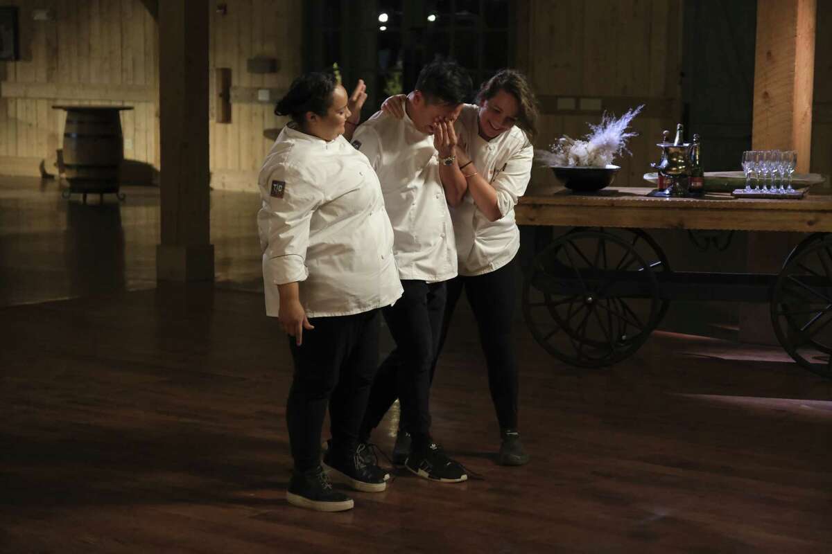 Buddha Lo, center is named winner of Season 19 of Bravo's "Top Chef Houston." He is congratulated by finalists Evelyn Garcia and Sarah Welch.