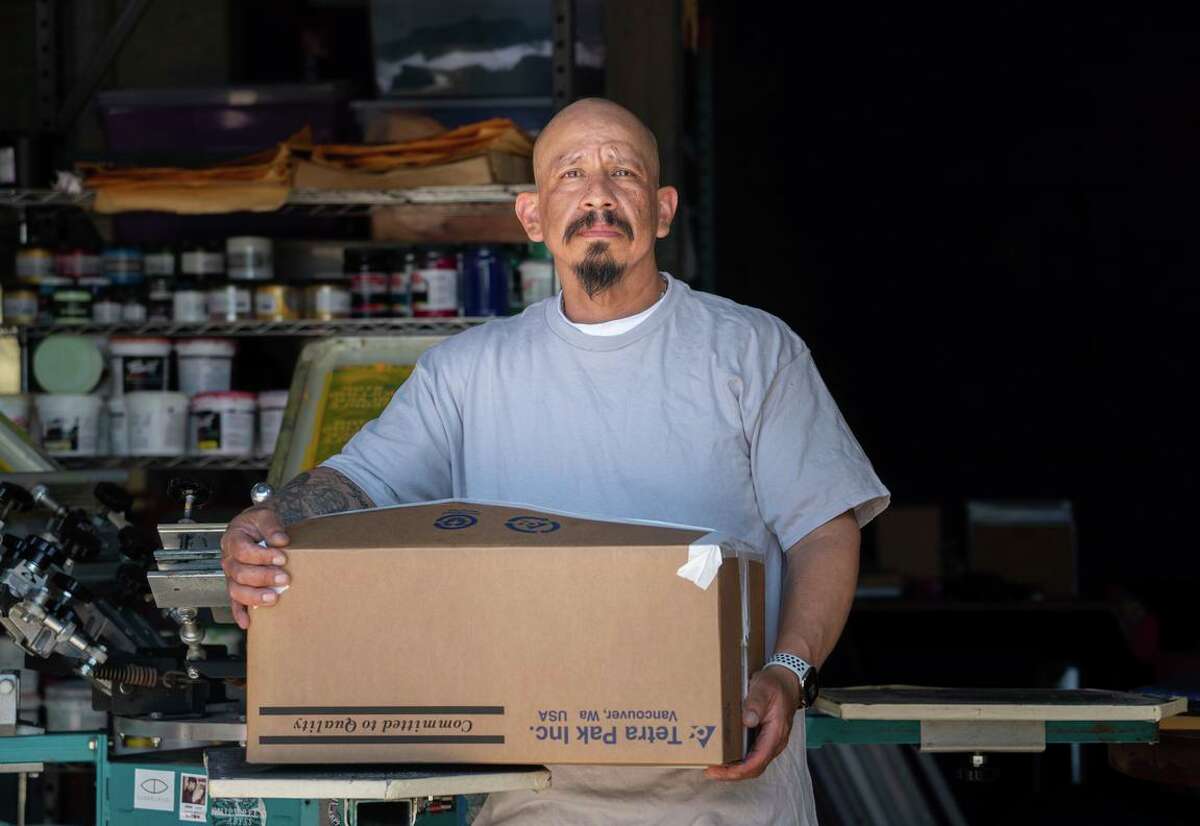 René Quiñonez, who owns screen-printing business Movement Ink in Oakland, filed a lawsuit accusing the United States Postal Service of illegally delaying his shipment of face masks to customers participating in racial justice protests around the country in June 2020.