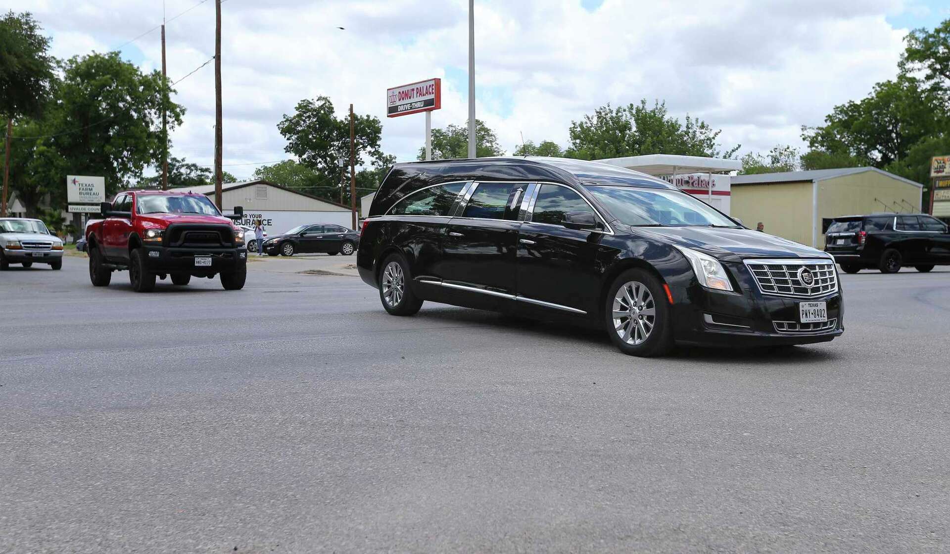 Funerals for children continue in Uvalde as bikers barricade press