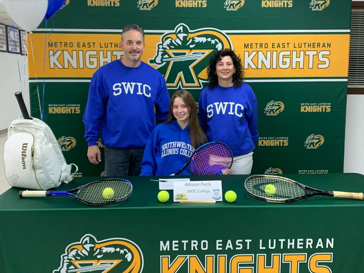 Allison Peck (center) is with her father, Tim (left), and mother, (Michelle), for her official signing with SWIC. 