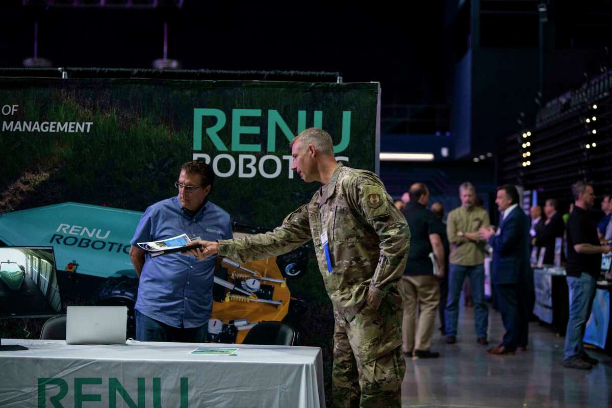 Col. Kevin Mantovani, right, vice commander of the Air Force Installation and Mission Support Center at Joint Base San Antonio, speaks with Steve Arters, vice president of marketing at Renu Robotics, during FORCECON 2022 at the Tech Port Center + Arena at Port San Antonio on May 25. The University of Texas at San Antonio’s Institute for Economic Development partnered with the Air Force and Port San Antonio for this first-of-its kind convention detailing the latest technology and innovative solutions that are improving military capabilities.