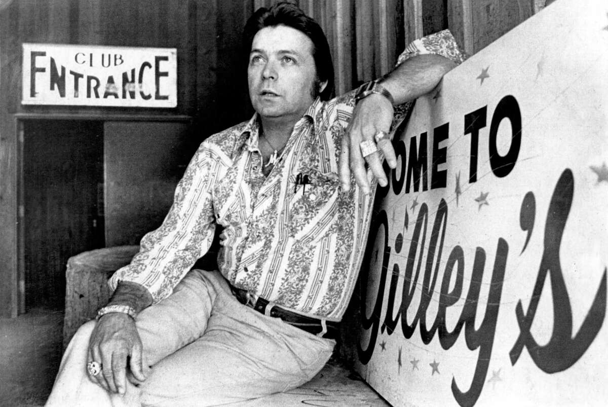 Mickey Gilley sits at the entrance to Gilley’s nightclub in 1979.