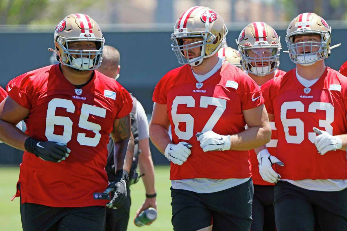 San Francisco 49ers offensive linemen Aaron Banks (65), Justin Skule (67) and Nick Zakelj (63) at the 49ers Training Facility on Wednesday, June 1, 2022, in Santa Clara, Calif.