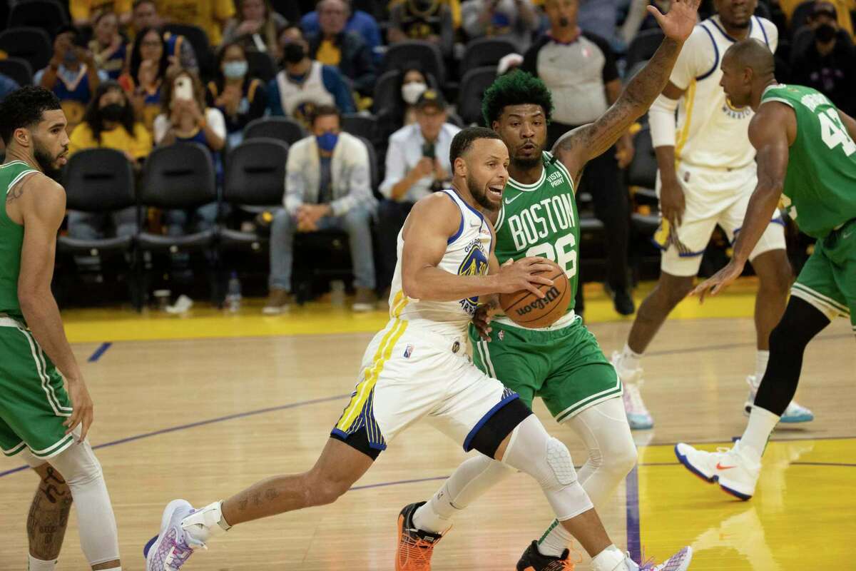 Golden State Warriors' Stephen Curry, 30, tries to get past Boston Celtics' Marcus Smart, 36, during the third quarter of the NBA Finals at Chase Center in San Francisco, Calif., on Thursday, June 2, 2022.