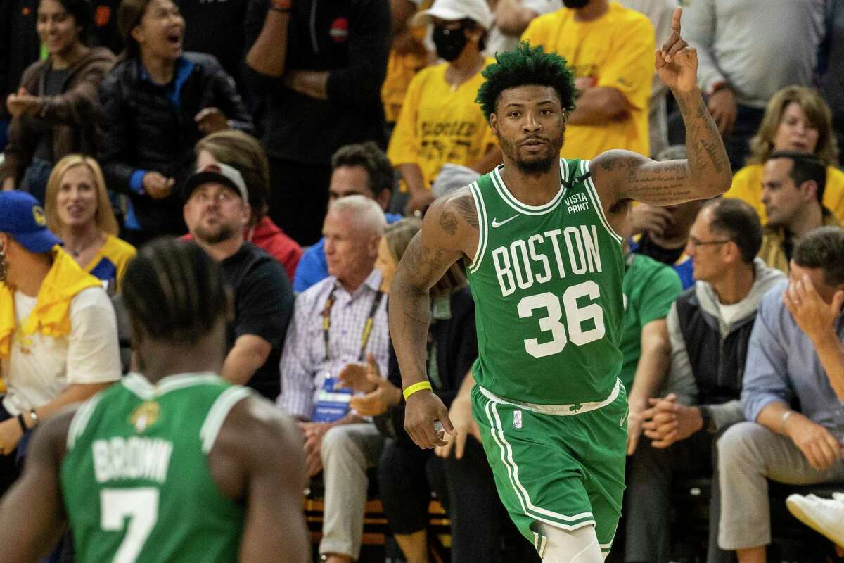 Boston Celtics' guard Marcus Smart gestures after making a three-pointer during the fourth quarter in Game 1 of the NBA Finals against the Golden State Warriors at Chase Center in San Francisco, Calif. Thursday, June 2, 2022. The Celtics defeated the Warriors 120-108.