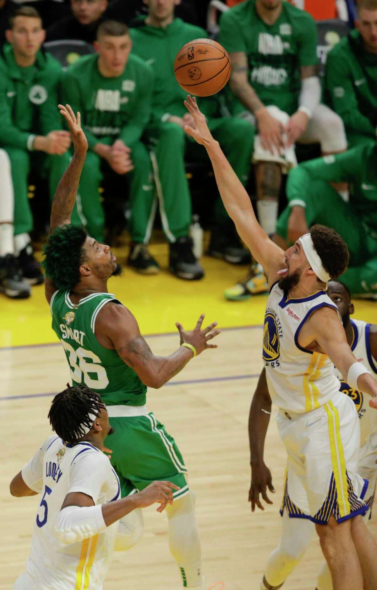 Boston Celtics' Marcus Smart, 36, shoots over Golden State Warriors' Klay Thompson, 11, during the fourth quarter of the NBA Finals at Chase Center in San Francisco, Calif., on Thursday, June 2, 2022.