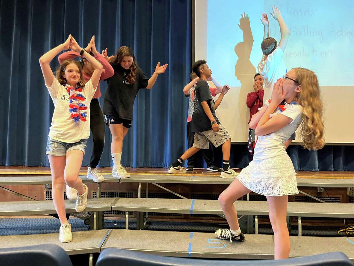 Seventh-grade students at Nathan Hale Middle School act out different parts of the fairy tale, "Jack and the Beanstalk," during the school's arts integration showcase on Friday, May 27, 2022. The performances are part of the schoolwide initiative to integrate arts concepts into the curriculum of core subjects.