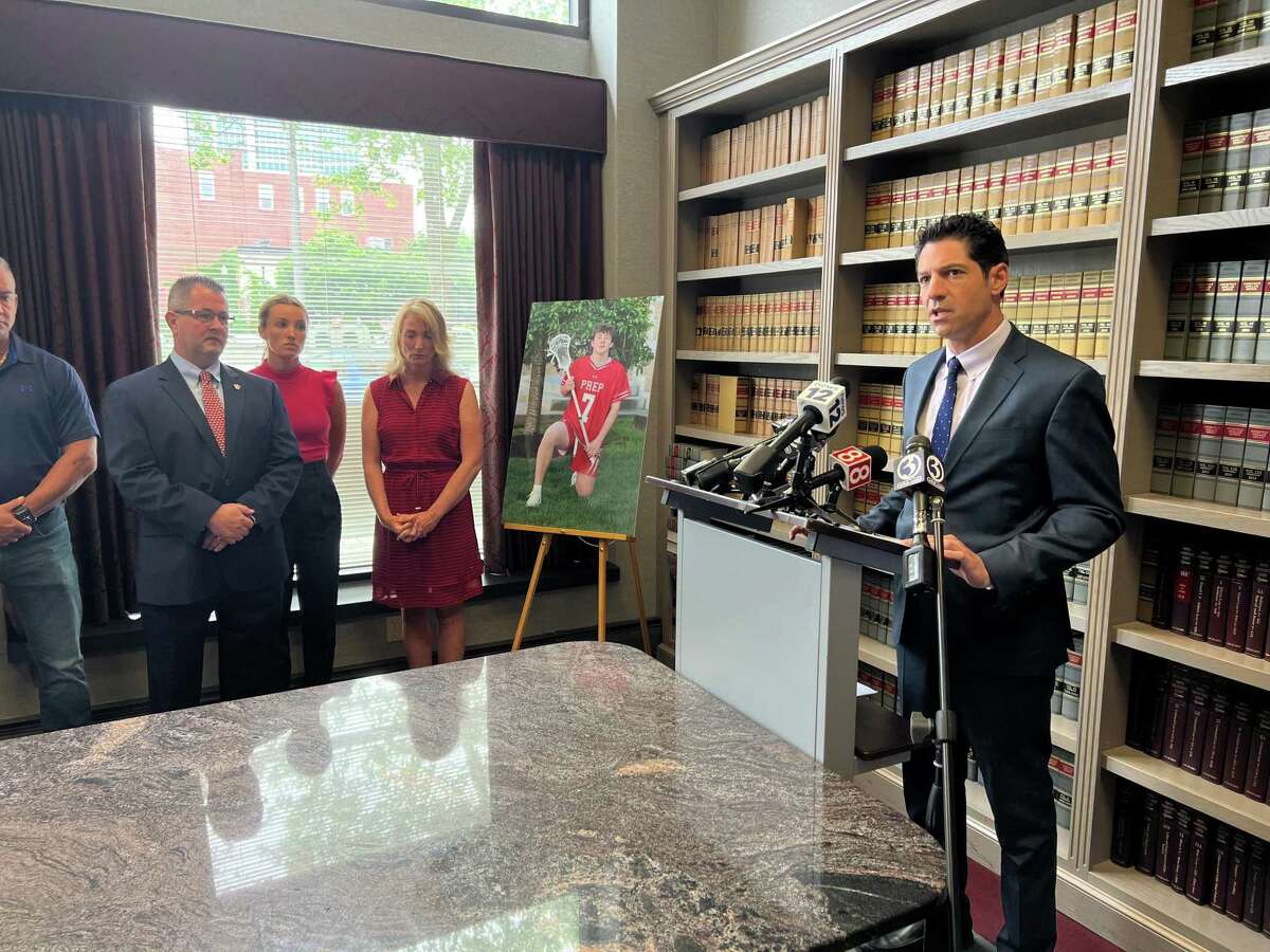 Attorney Michael Rosnick, flanked by the McGrath family, addresses the media during a press conference in Bridgeport Friday, June 3, 2022.