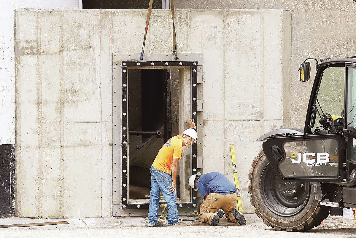 John Badman|The Telegraph Workers at Ardent Mills on West Broadway in Alton were installing the door frames for water tight doors to be installed in places between grain silos on Wednesday.