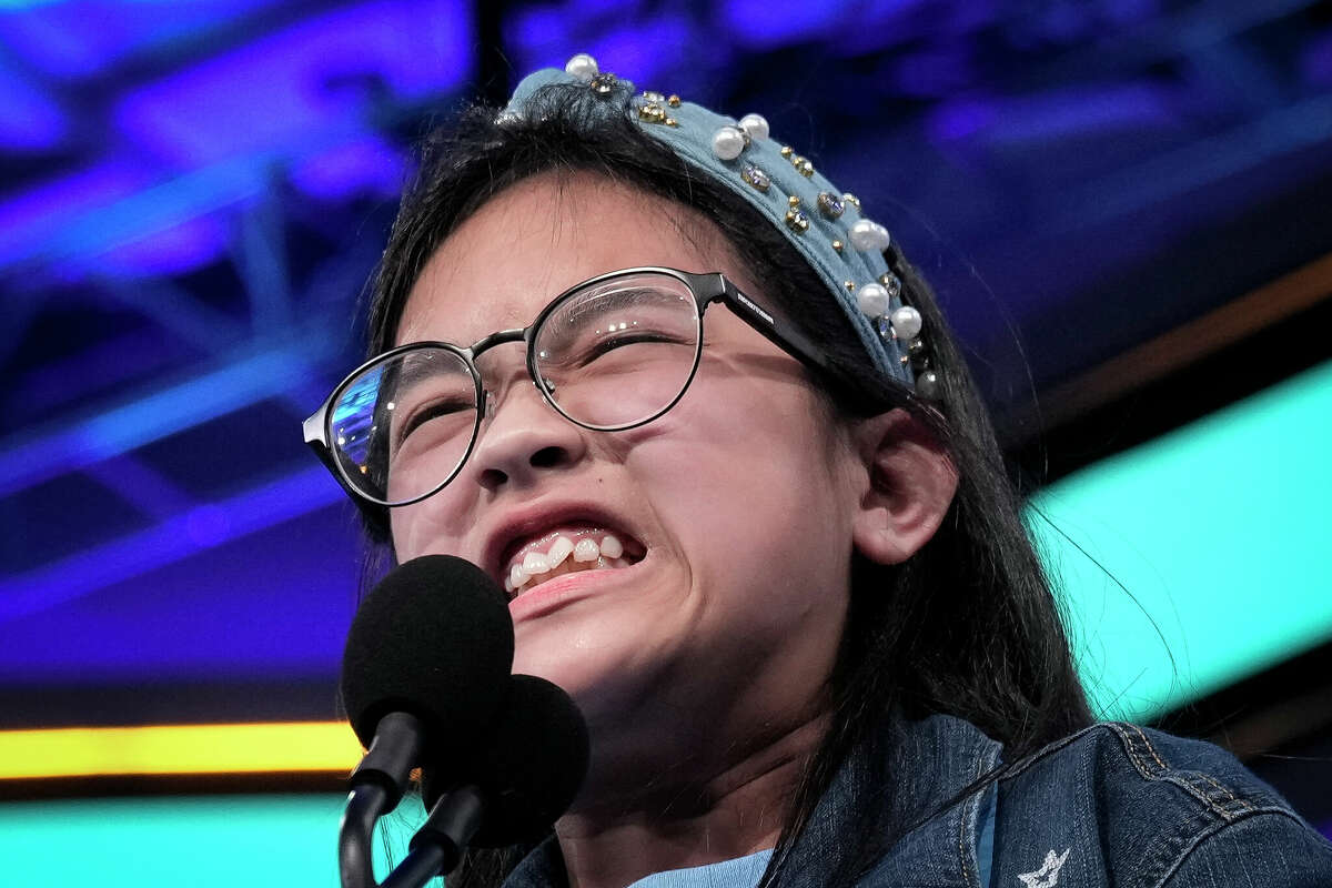 11-year-old Kirsten Santos from Houston, Texas reacts as she misspells a word during the final round of the Scripps National Spelling Bee at the Gaylord National Harbor Resort on June 2, 2022 in Oxon Hill, Maryland.