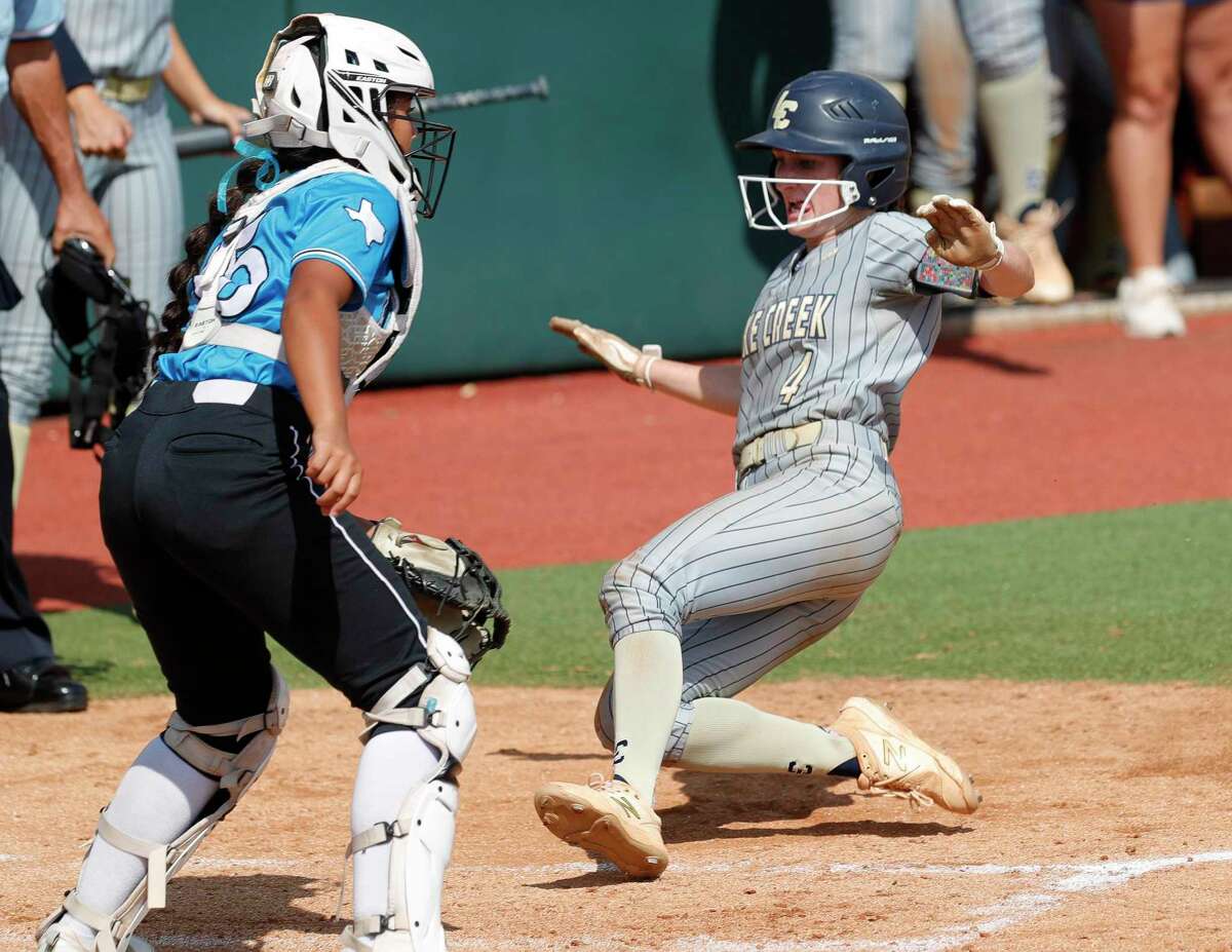 Caelee Clark #4 of Lake Creek scores on a 2-RBI single by Shelby Winn in the first inning of their Class 5A semifinal game during the UIL State Softball Championships at Red & Charline McCombs Field, Friday, June 3, 2022, Austin.