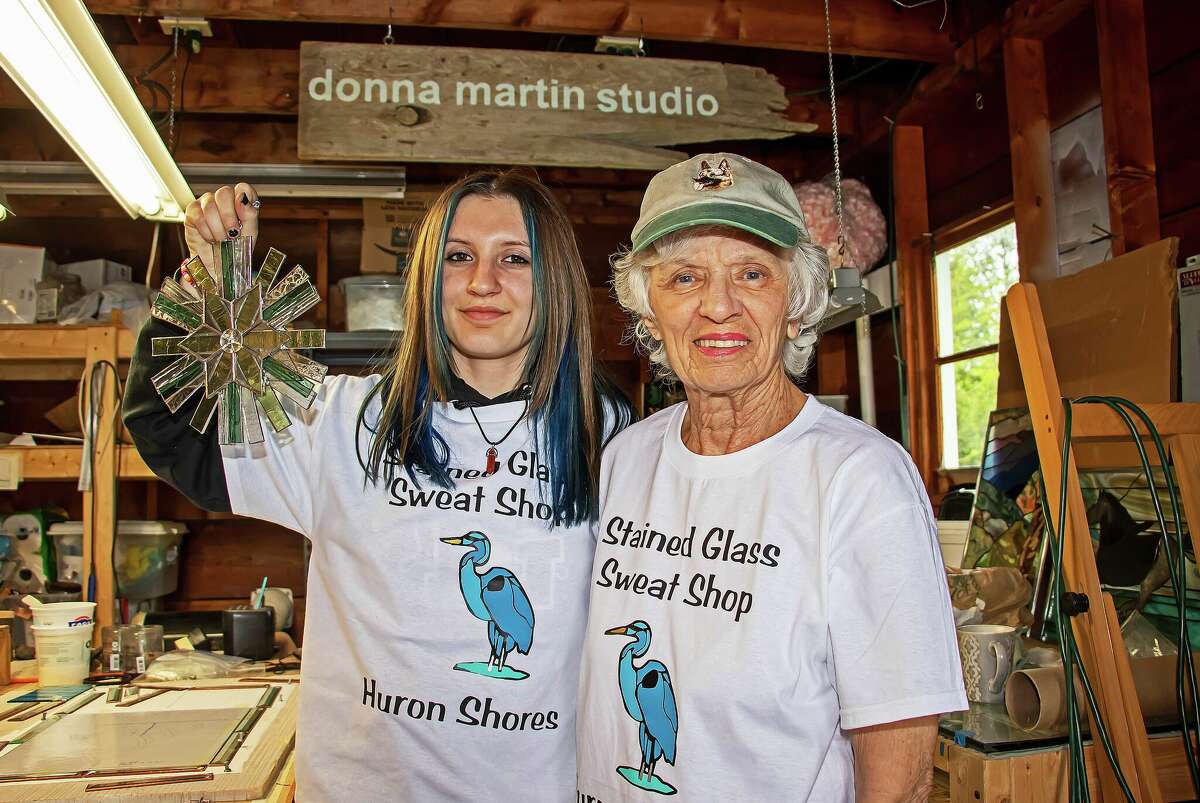 Donna Martin, left, a stained glass artist from Pigeon, in her studio alongside her apprentice, 15-year-old Shawnnessy Renn of Pigeon.