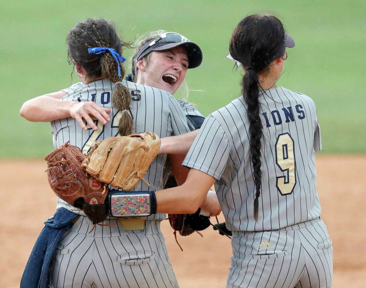 Lake Creek’s Payton Bauer hugs Ava Brown after the team’s 8-2 win over Prosper Rock Hill to advance to Saturday’s Class 5A state championship game at Red & Charline McCombs Field, Friday, June 3, 2022, Austin.