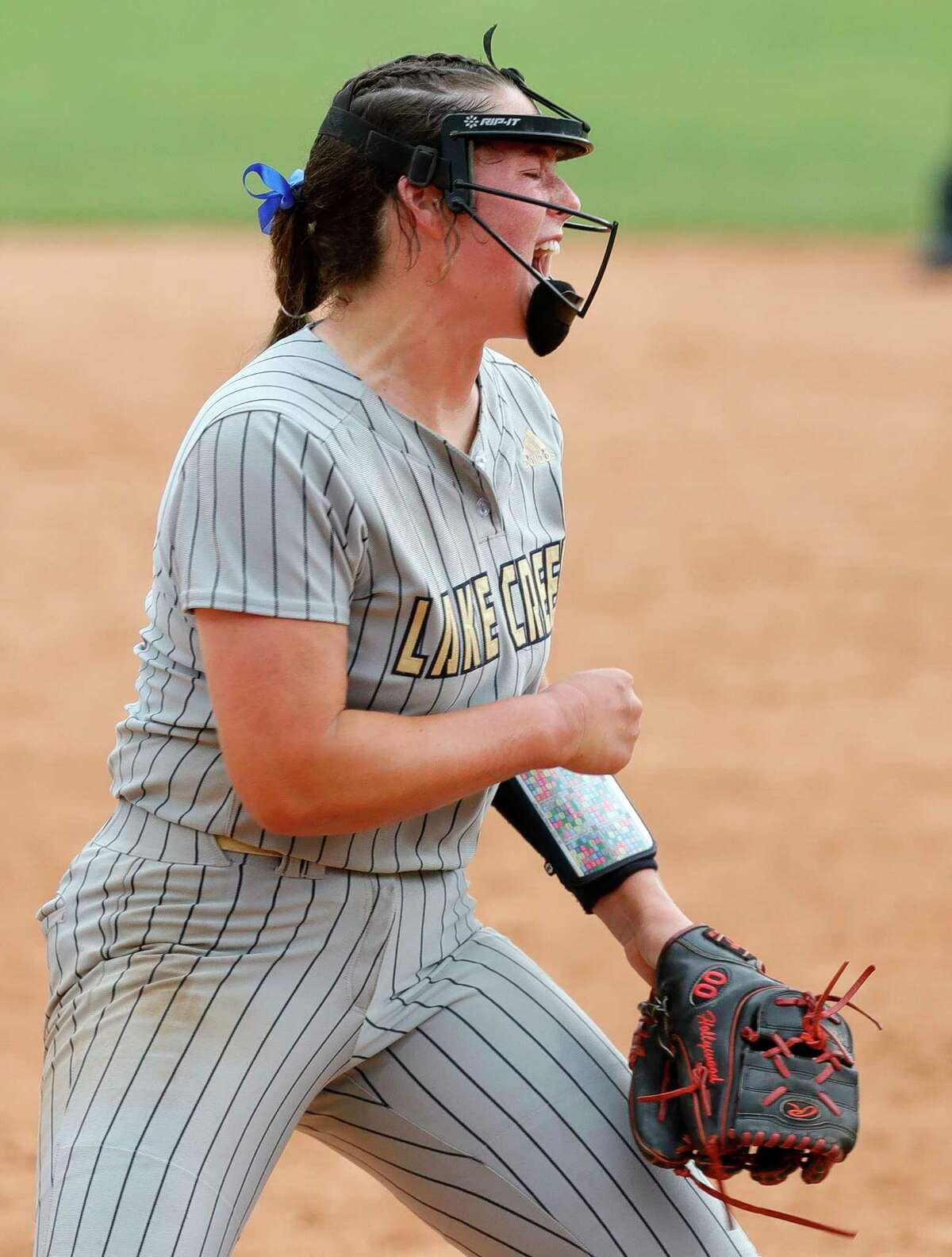 Lake Creek starting pitcher Ava Brown (22) reacts after striking out Aislynn Hardin #6 of Prosper Rock Hill with the bases loaded to end the top of the sixth inning of their Class 5A semifinal game during the UIL State Softball Championships at Red & Charline McCombs Field, Friday, June 3, 2022, Austin.